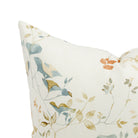 Close up of Tonic Living Laurel Meadow cushion showing ivory, dusty blue, terracotta, and wheat botanical detail.