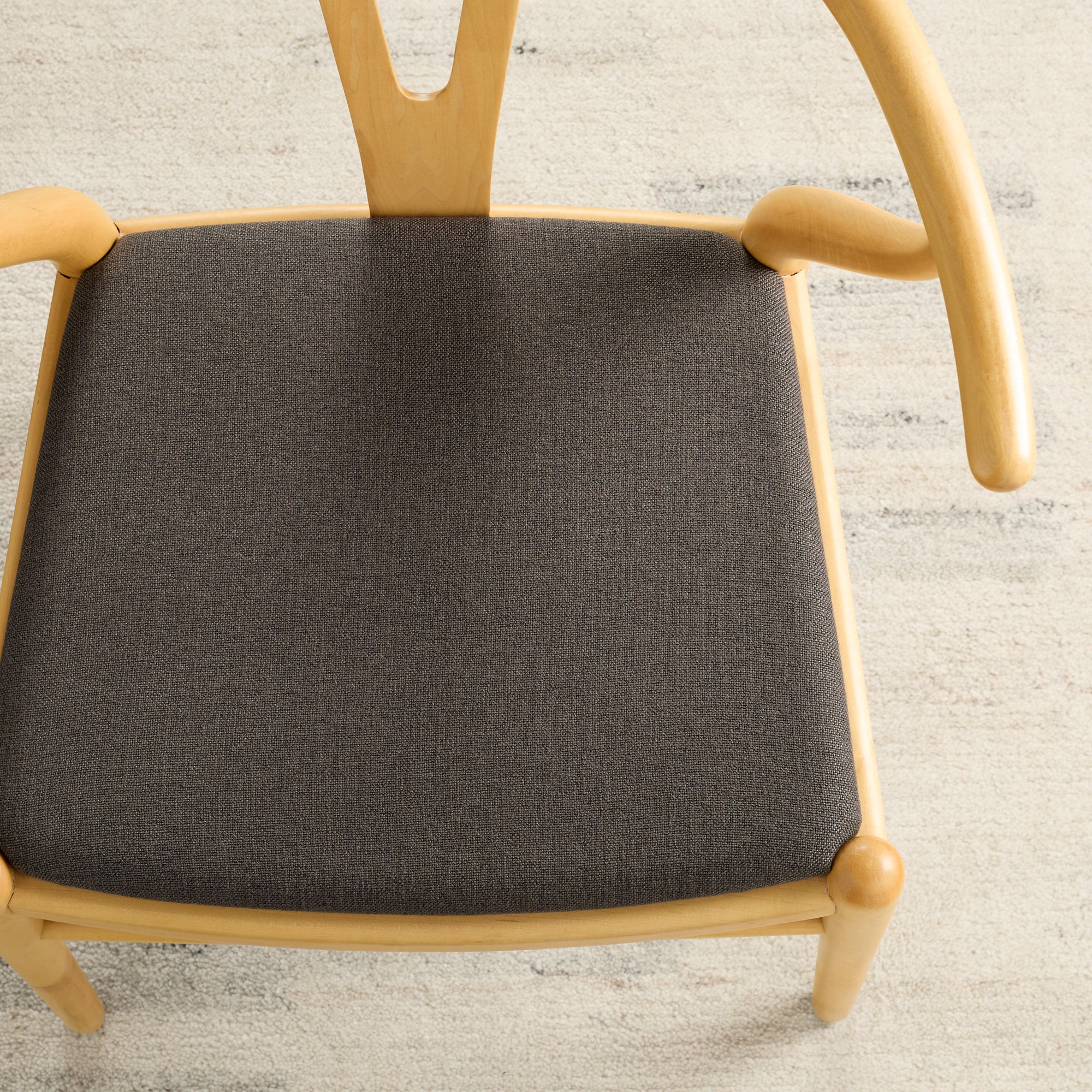 Dining seat upholstered in Loden Fabric, Mink by Tonic Living — durable high-performance upholstery fabric in a soft brown-grey tone.