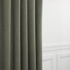 Loden Fabric, Sage by Tonic Living — high-performance linen-look fabric in muted sage green, shown as drapery.
