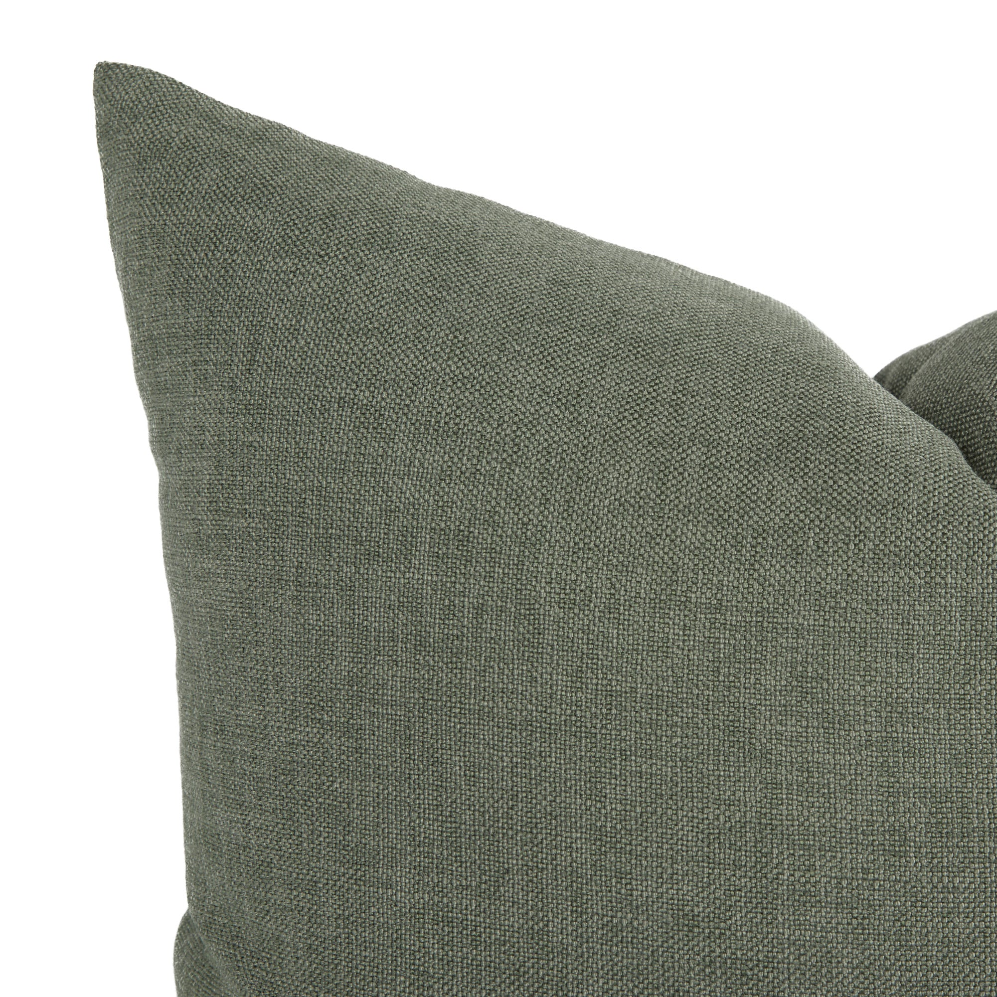 Close up of Tonic Living Loden Sage throw pillow showing its soft green, linen-textured fabric.