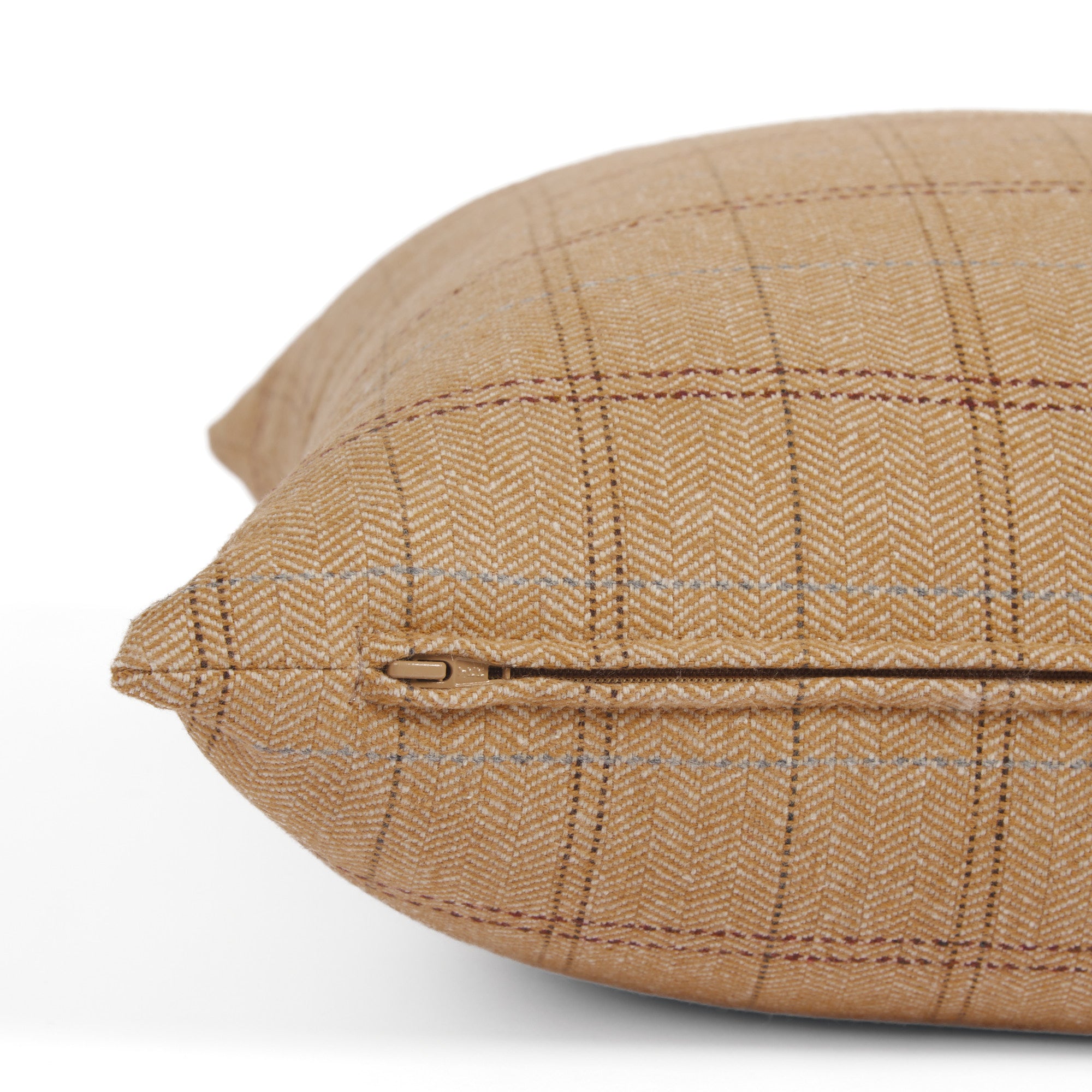 Side zipper detail of Tonic Living Lundie Plaid 20x20 pillow in a camel plaid with wool-blend texture.