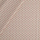 Lyra Fabric, Berry by Tonic Living — white and faded burgundy floral block print on a lightweight linen-blend fabric.