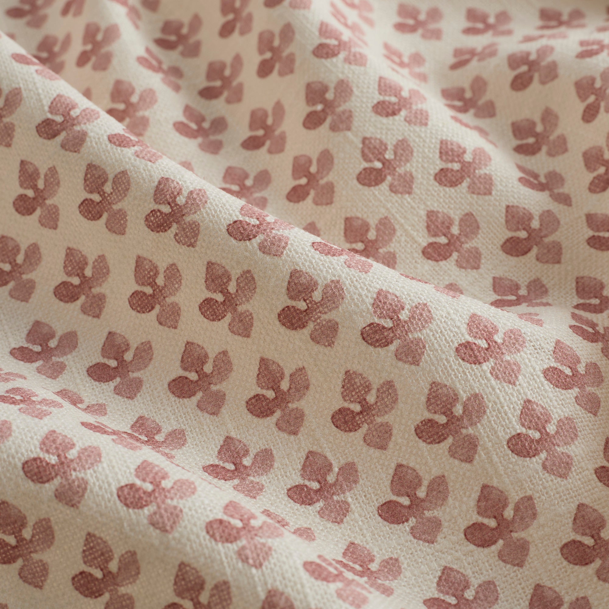 Close-up of Lyra Fabric, Berry by Tonic Living — lightweight linen-blend fabric with a detailed floral block print.