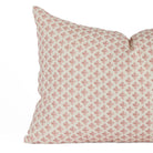 Close-up of Lyra Berry lumbar pillow by Tonic Living — delicate white and dark rose floral block print design.