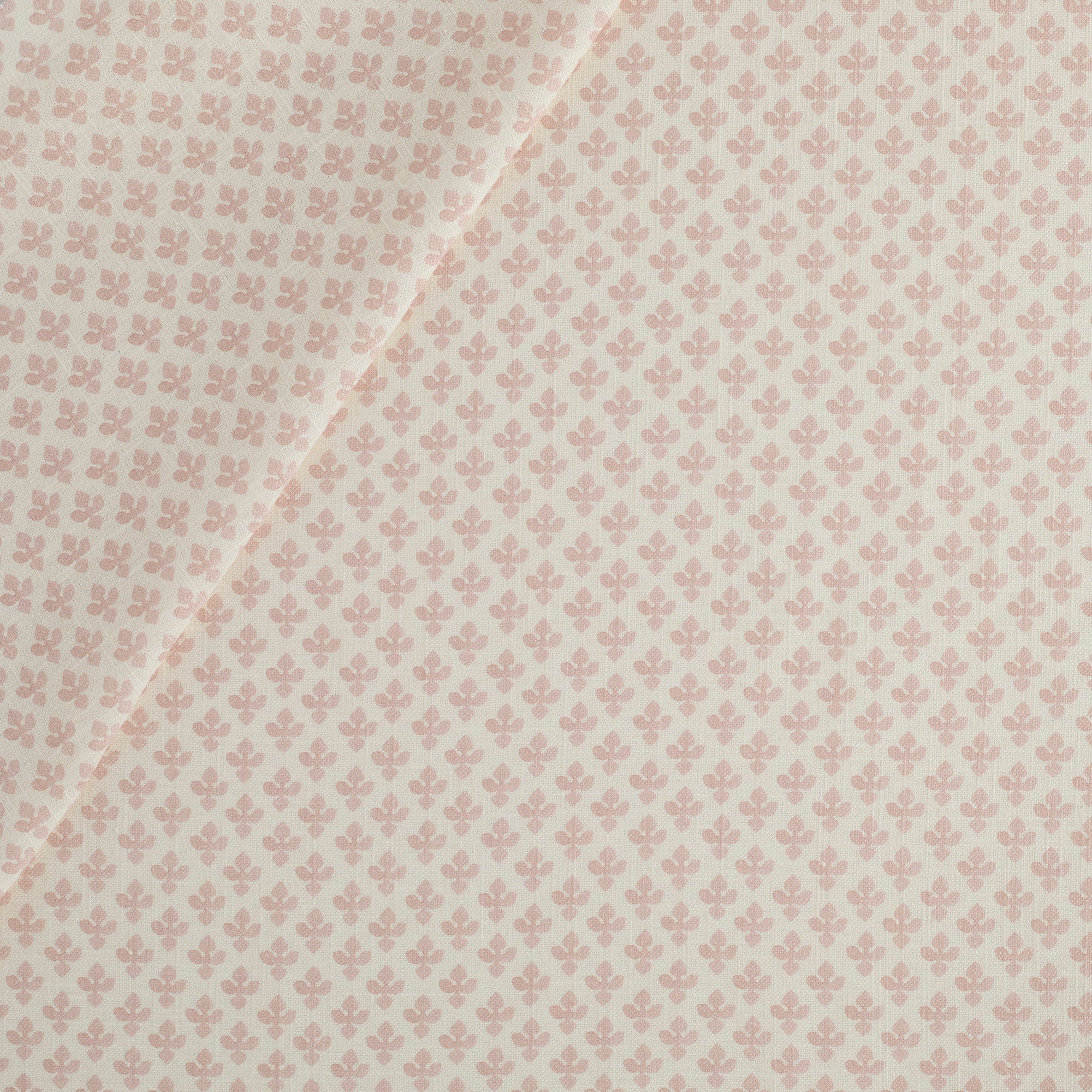 Lyra Fabric, Blush by Tonic Living — white and light pink floral block print on a lightweight linen-blend fabric.