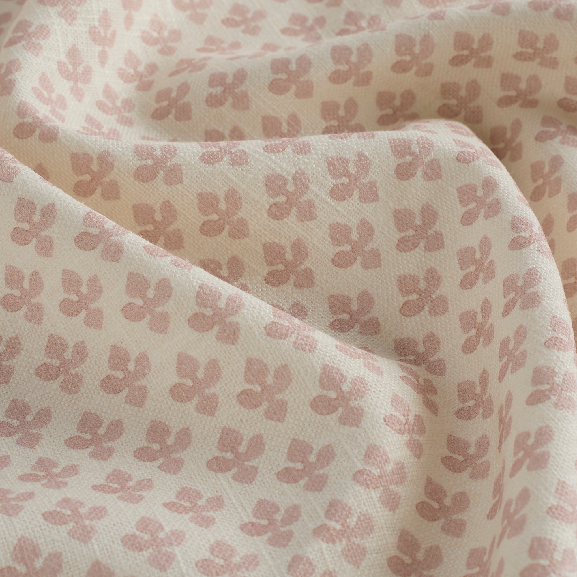 Close-up of Lyra Fabric, Blush by Tonic Living — lightweight linen-blend fabric with a delicate floral block print.