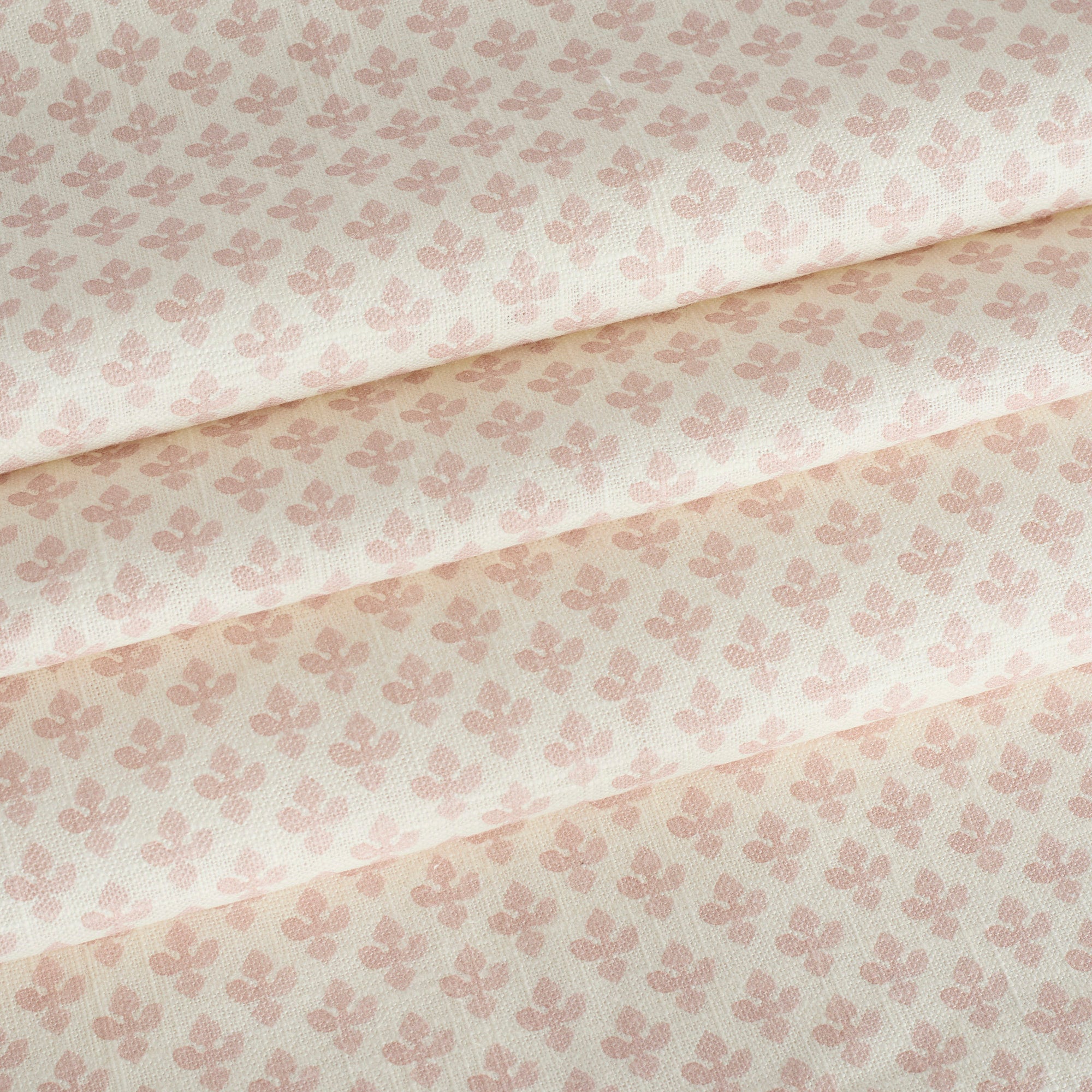 Lyra Blush roman shade fabric by Tonic Living — lightweight linen-blend fabric with a white and soft pink floral block print.