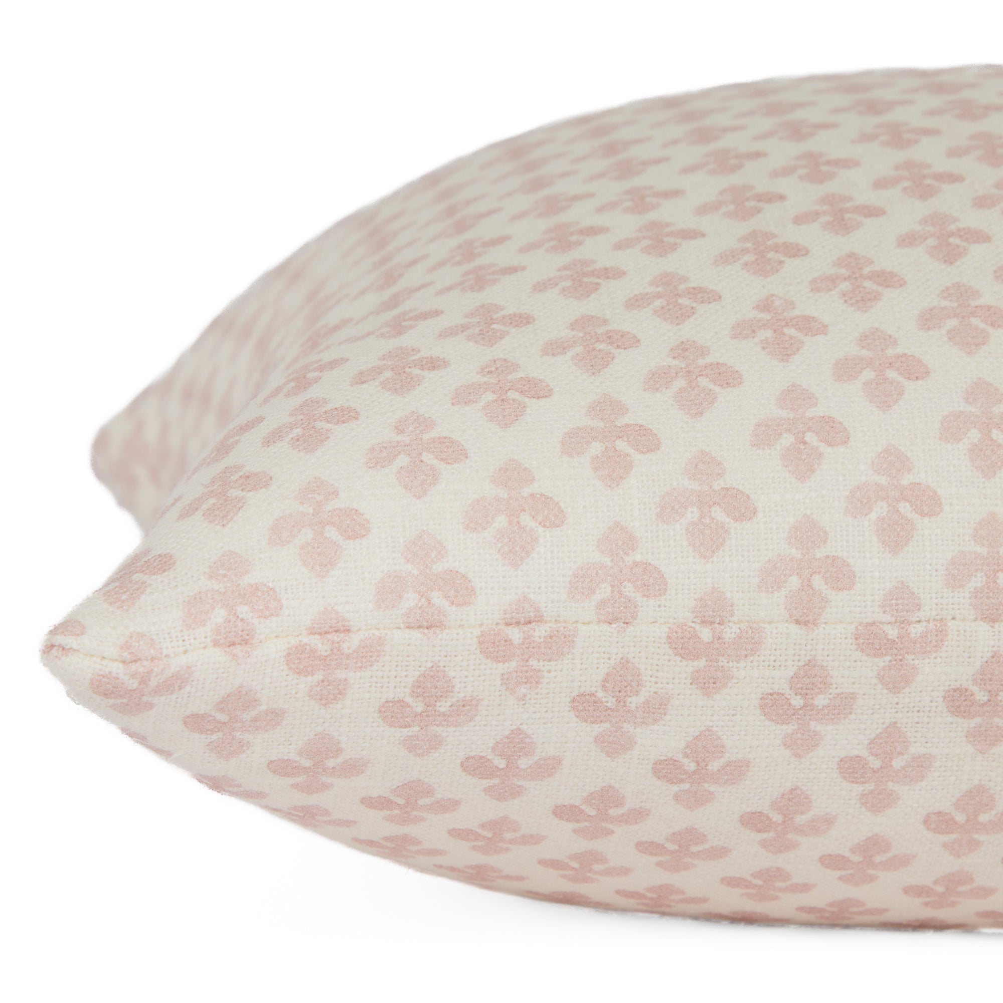 Close-up side view of Lyra Blush lumbar cushion by Tonic Living — floral block print in soft white and baby pink tones.