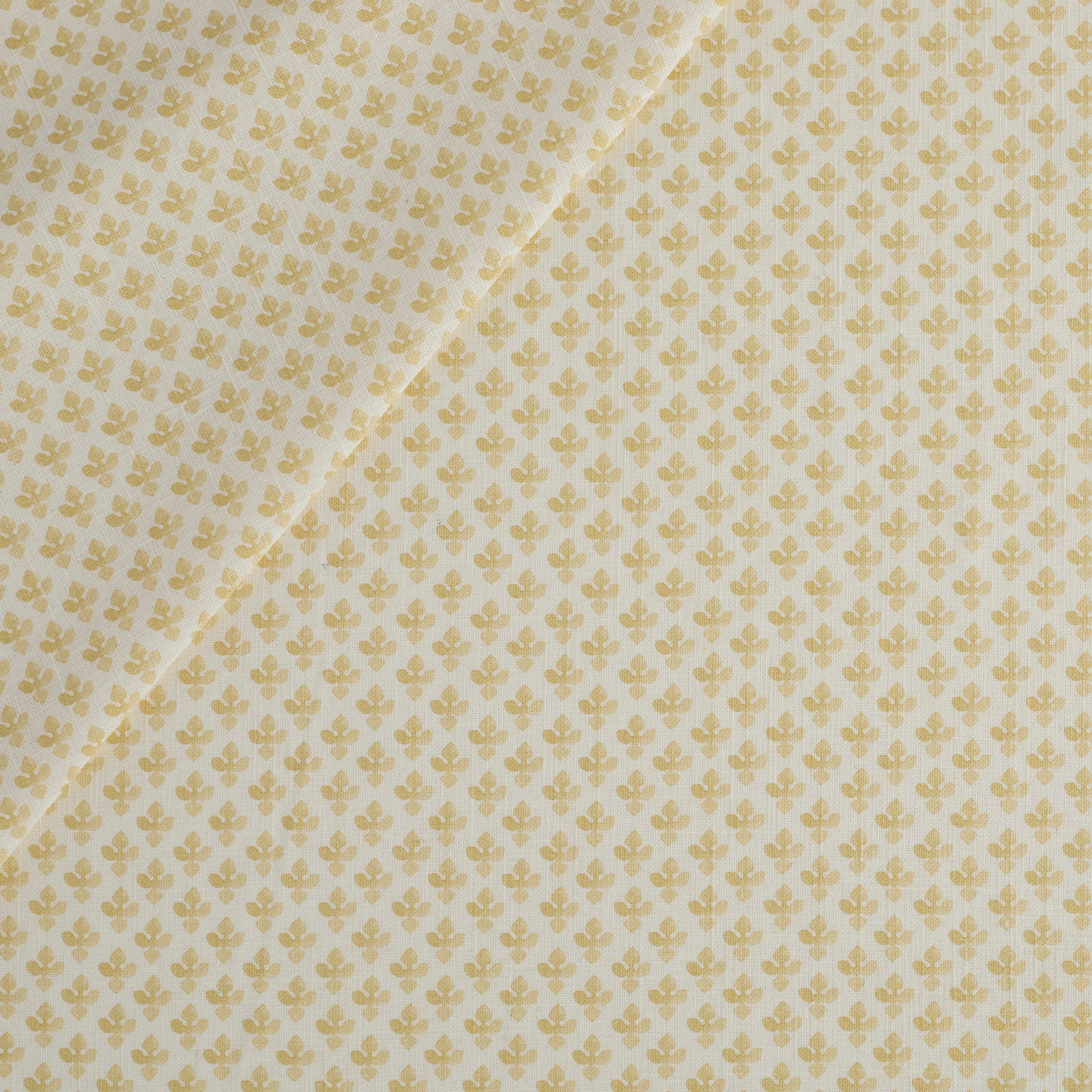Lyra Fabric, Butter Yellow by Tonic Living — white and yellow floral block print on a lightweight linen-blend fabric.