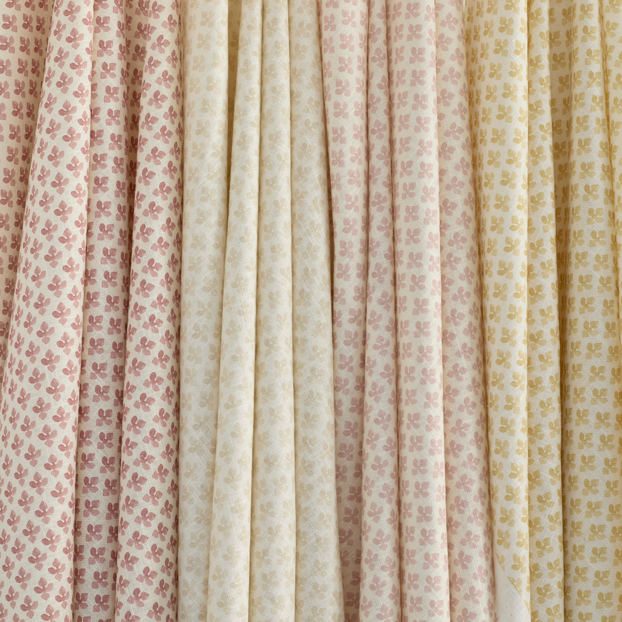 Lyra Fabrics by Tonic Living in Berry, Parchment, Blush, and Butter Yellow — linen-blend floral block prints in soft romantic tones.