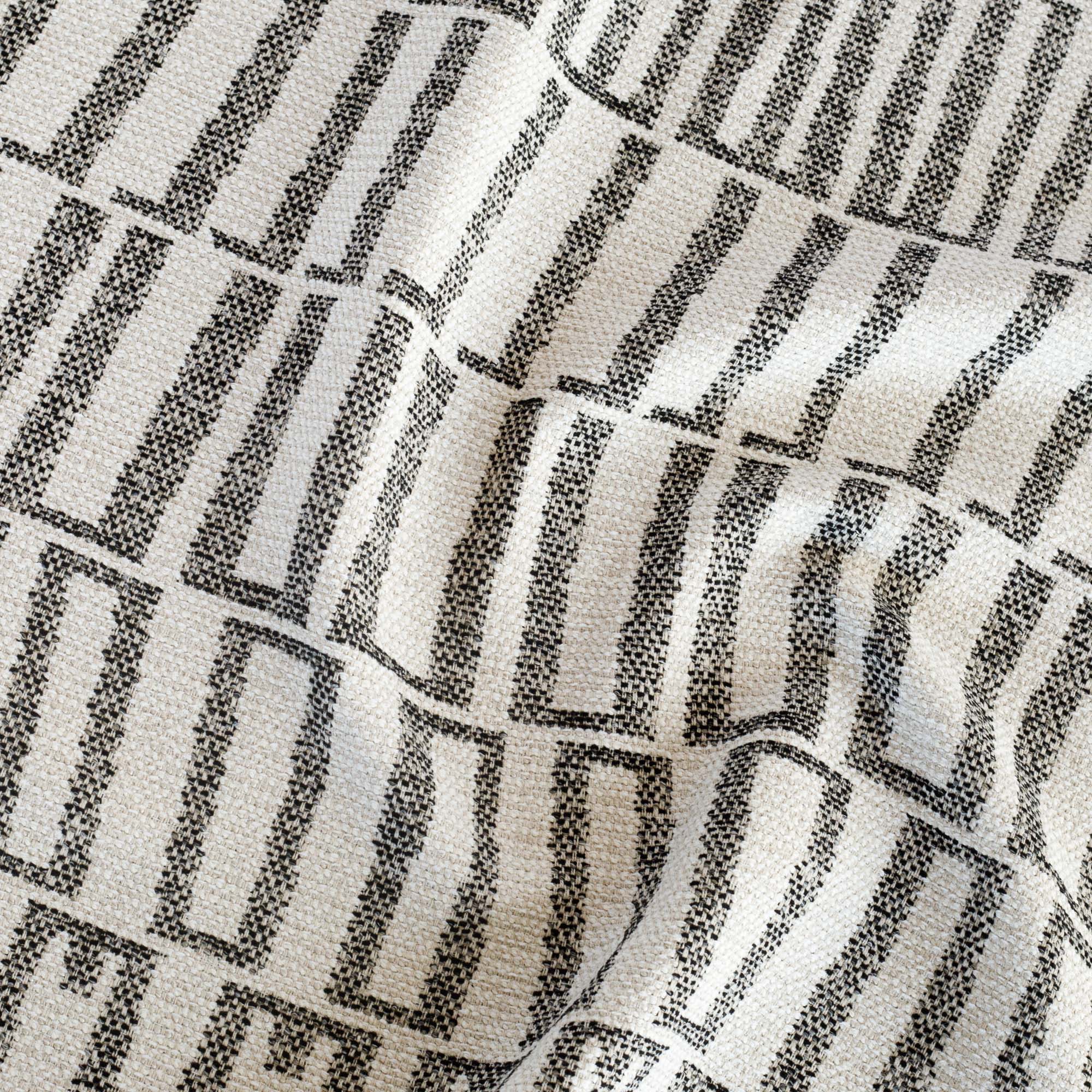 a black and sand beige abstract geometric patterned outdoor fabric from Tonic Living