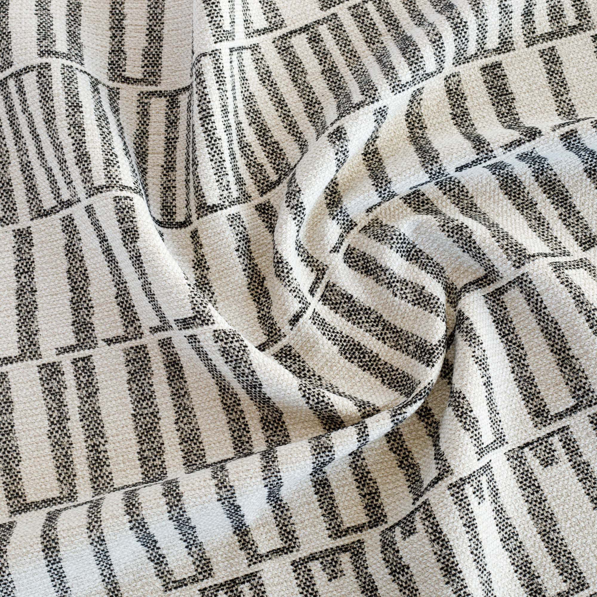 a black and sand beige abstract geometric patterned outdoor fabric from Tonic Living