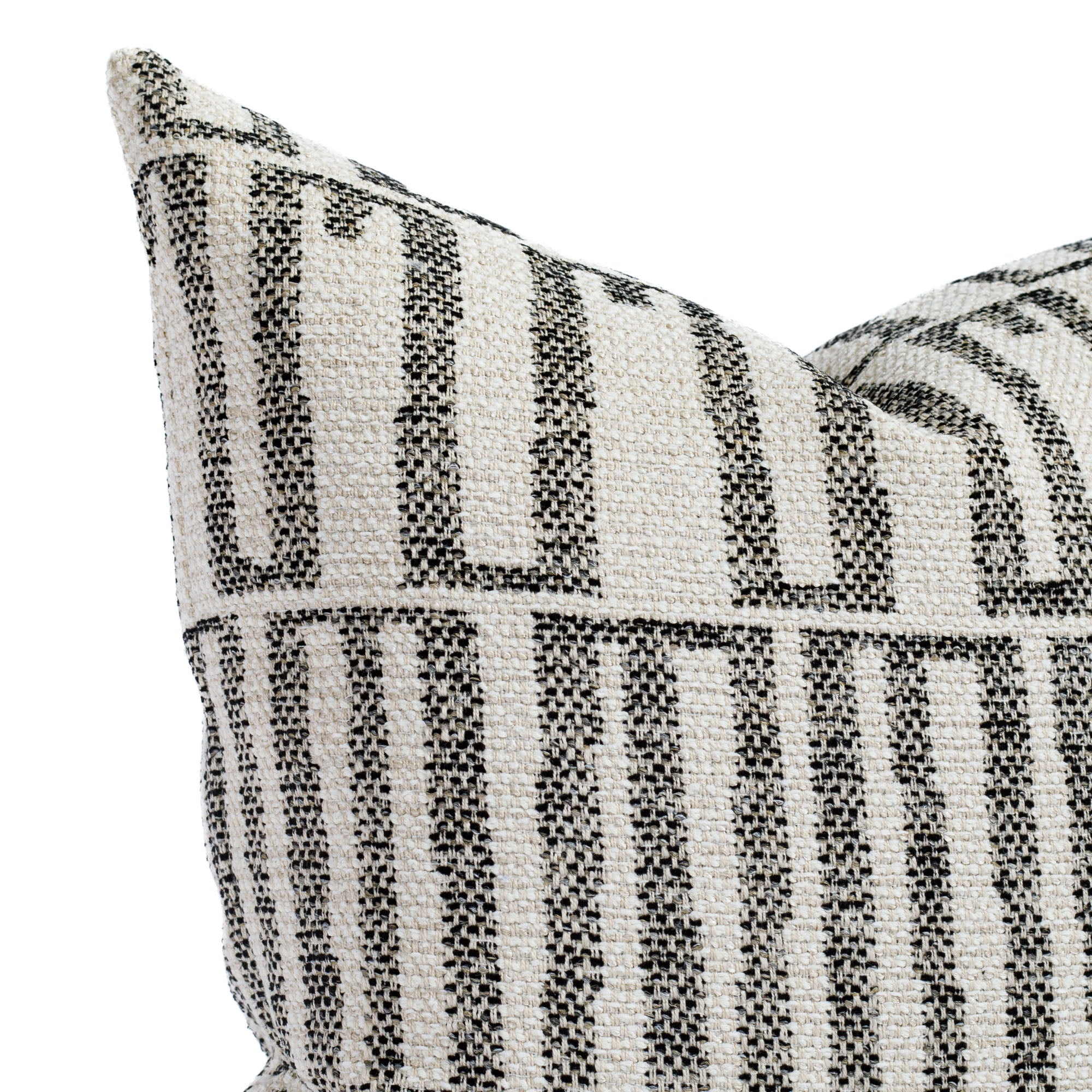 a cream and black organic geometric outdoor throw pillow : close up view