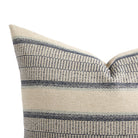 Close up of Tonic Living Miller Stripe Denim pillow showing navy blue, light blue, and beige banded stripes with woven texture.