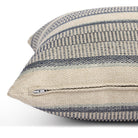 Side zipper detail of Tonic Living Miller Stripe 22x22 toss cushion in dark blue, light blue, and beige stripes.