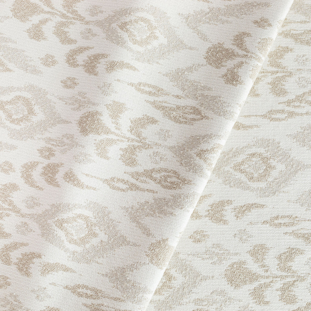 a cream, white and taupe oversized ikat patterned indoor outdoor fabric 