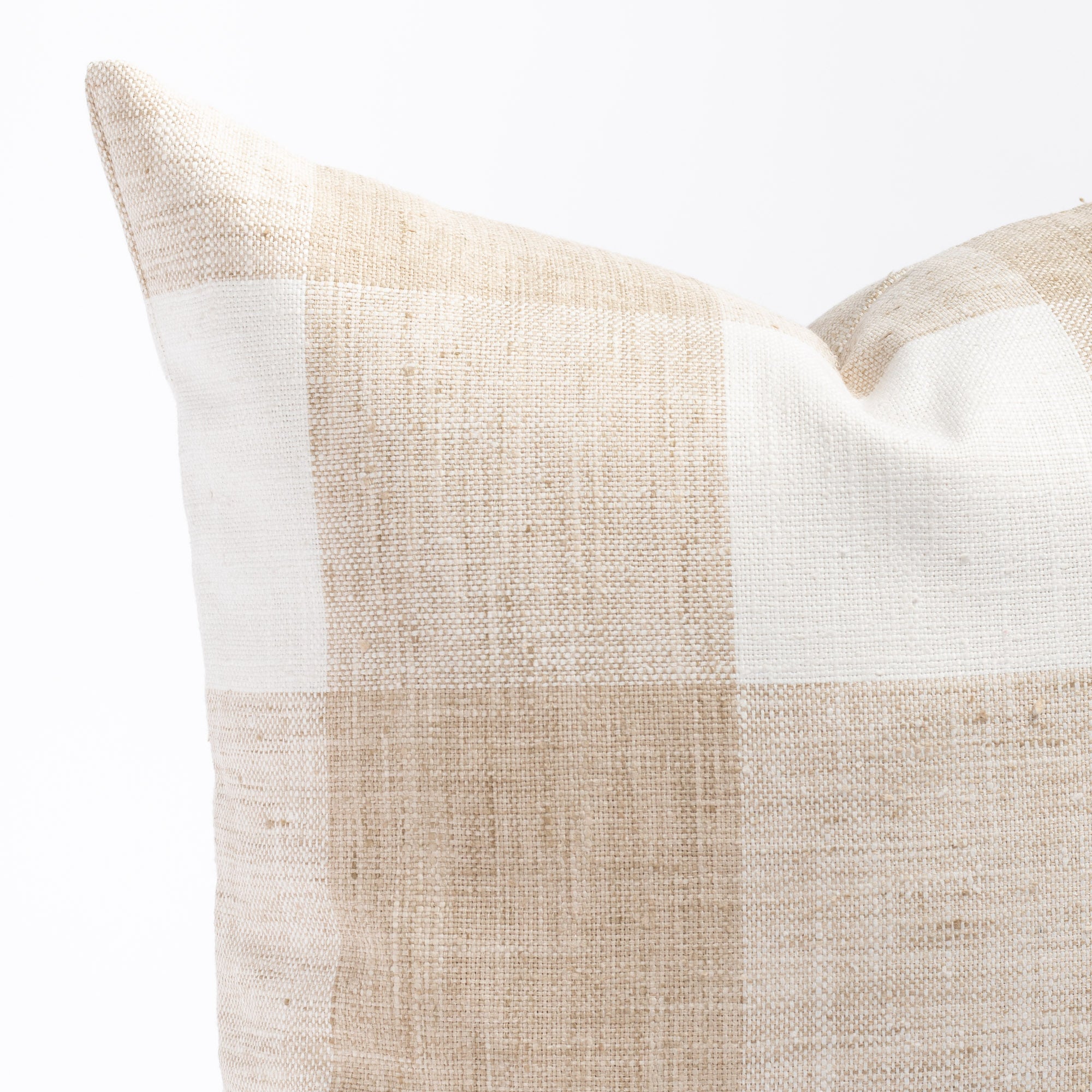 a white and beige buffalo check patterned throw pillow : close up view