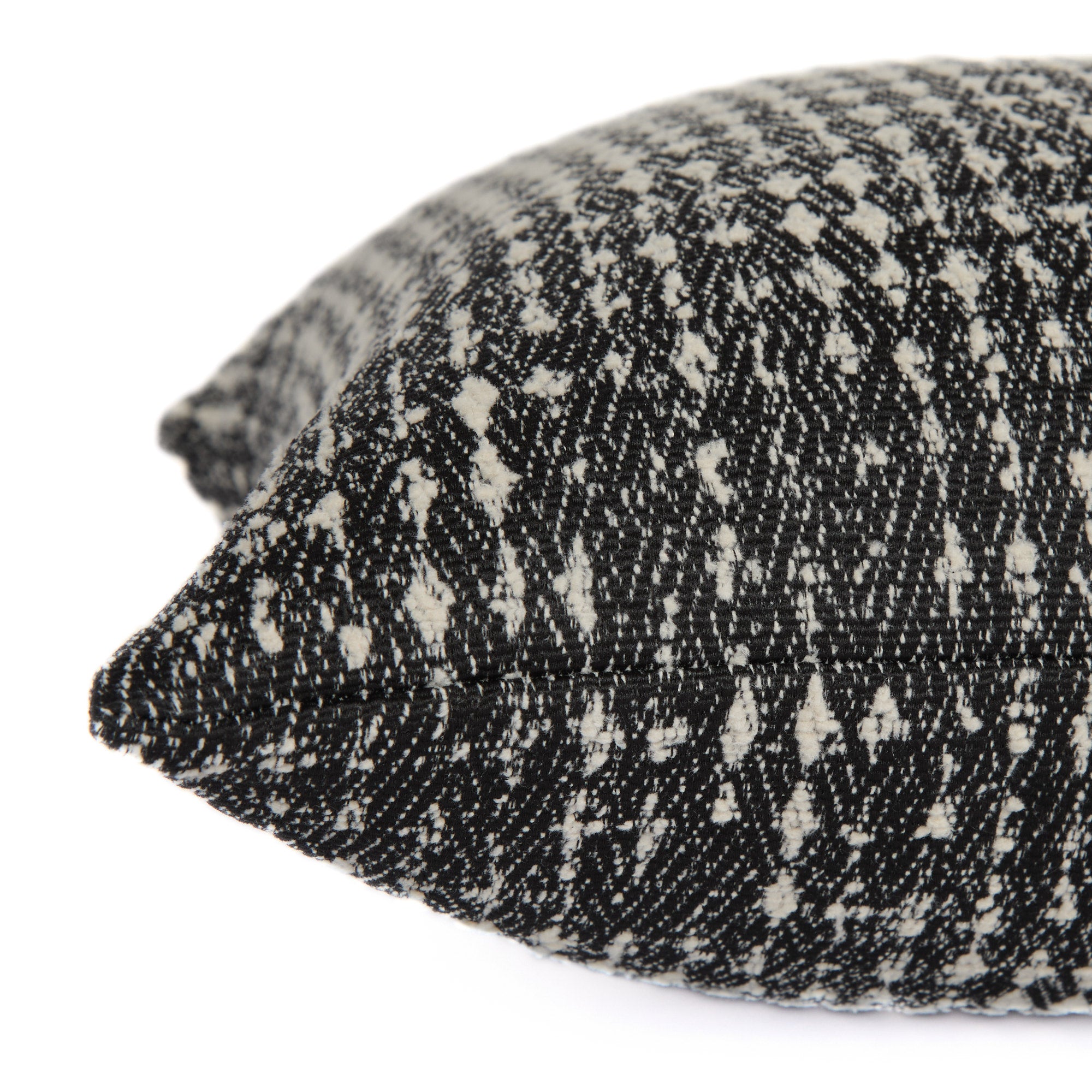 Side view of Otto Domino Pillow by Tonic Living – modern black and white decorative pillow with texture.