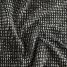 Otto Domino home decor fabric by Tonic Living — black and white abstract geometric design with a modern edge.