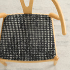 Dining chair upholstered in Otto Fabric, Domino by Tonic Living — bold black and white geometric upholstery fabric.