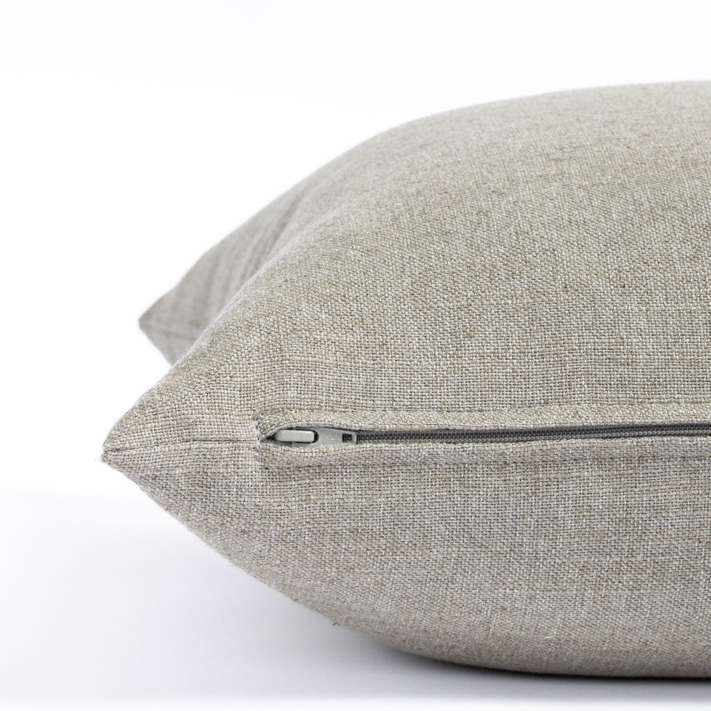 a solid dusty grey green throw pillow : close up zipper view