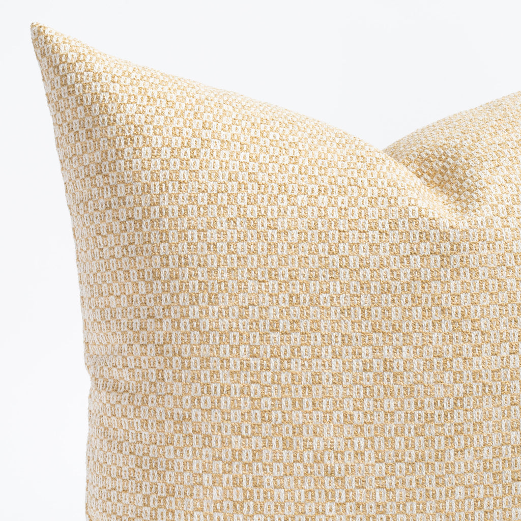 a yellow gold and cream small check patterned throw pillow : close up view
