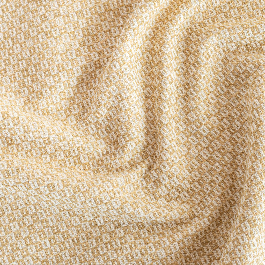 Paige Cornsilk, a soft gold and cream small scaled geometric patterned upholstery fabric from Tonic Living 
