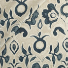Tonic Living Paloma Fabric in Ink, a navy blue floral drapery fabric with bold blooms and scrolling leaves on an oatmeal beige ground.