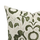 Close up of Tonic Living Paloma Olive pillow showing painterly olive green flowers and scrolling leaves on oatmeal beige.