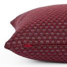 Close up of zipper on Pembrook 20x20 burgundy red indoor pillow with diamond design, Tonic Living.