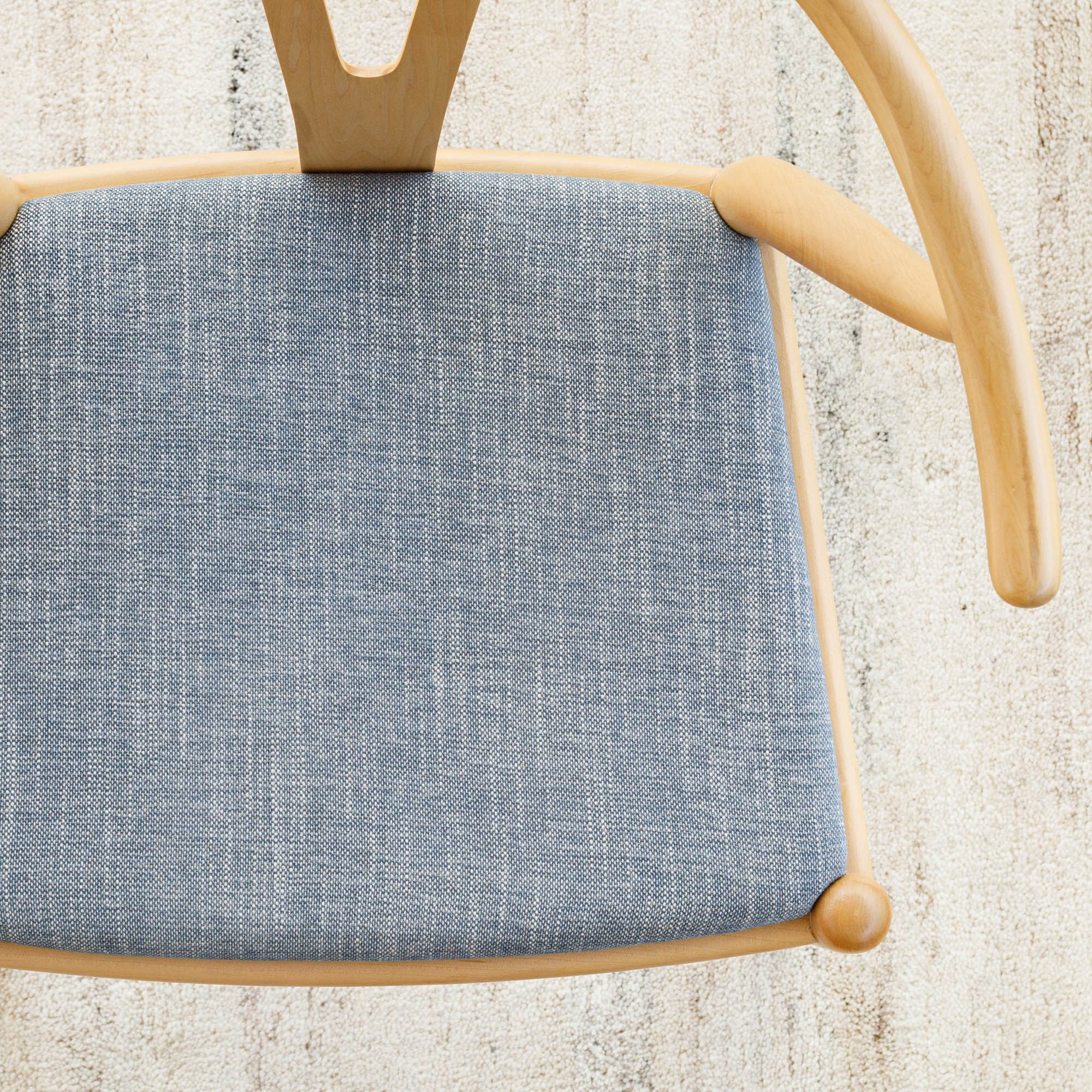 a chambray blue fabric upholstered chair seat