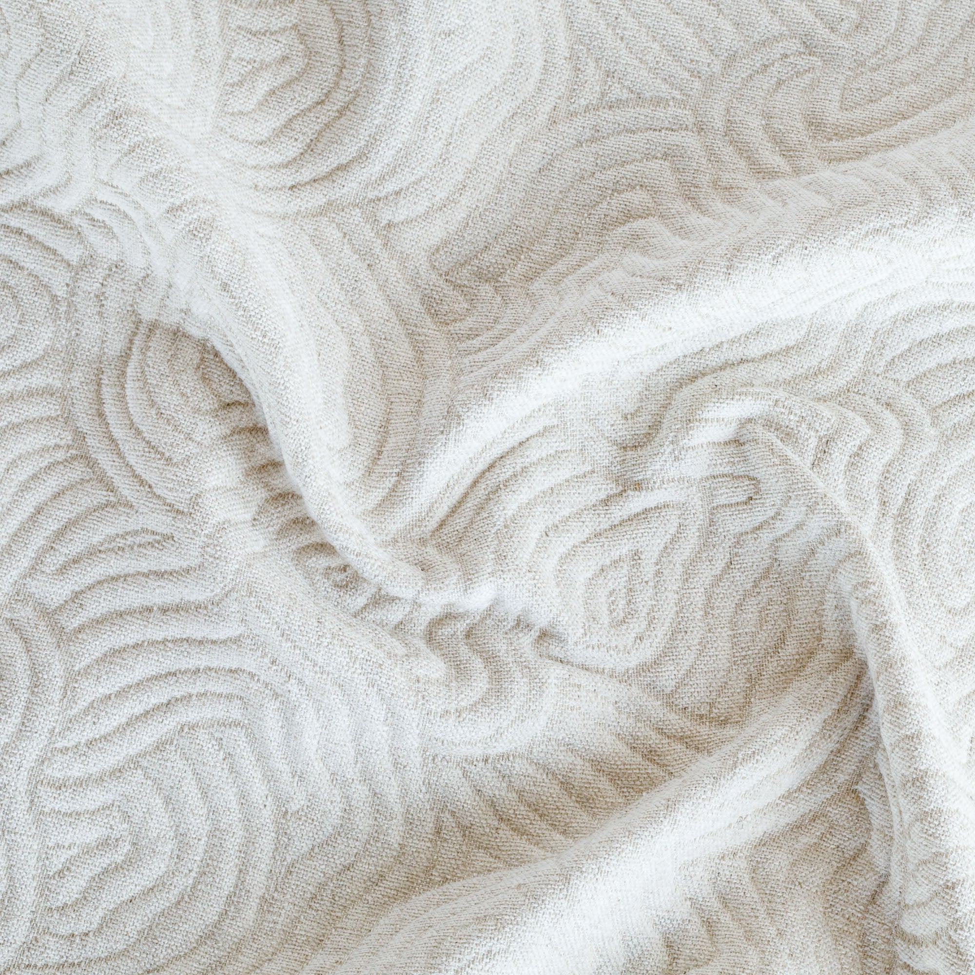 a soft cream and beige quilted abstract wave patterned home decorfabric 