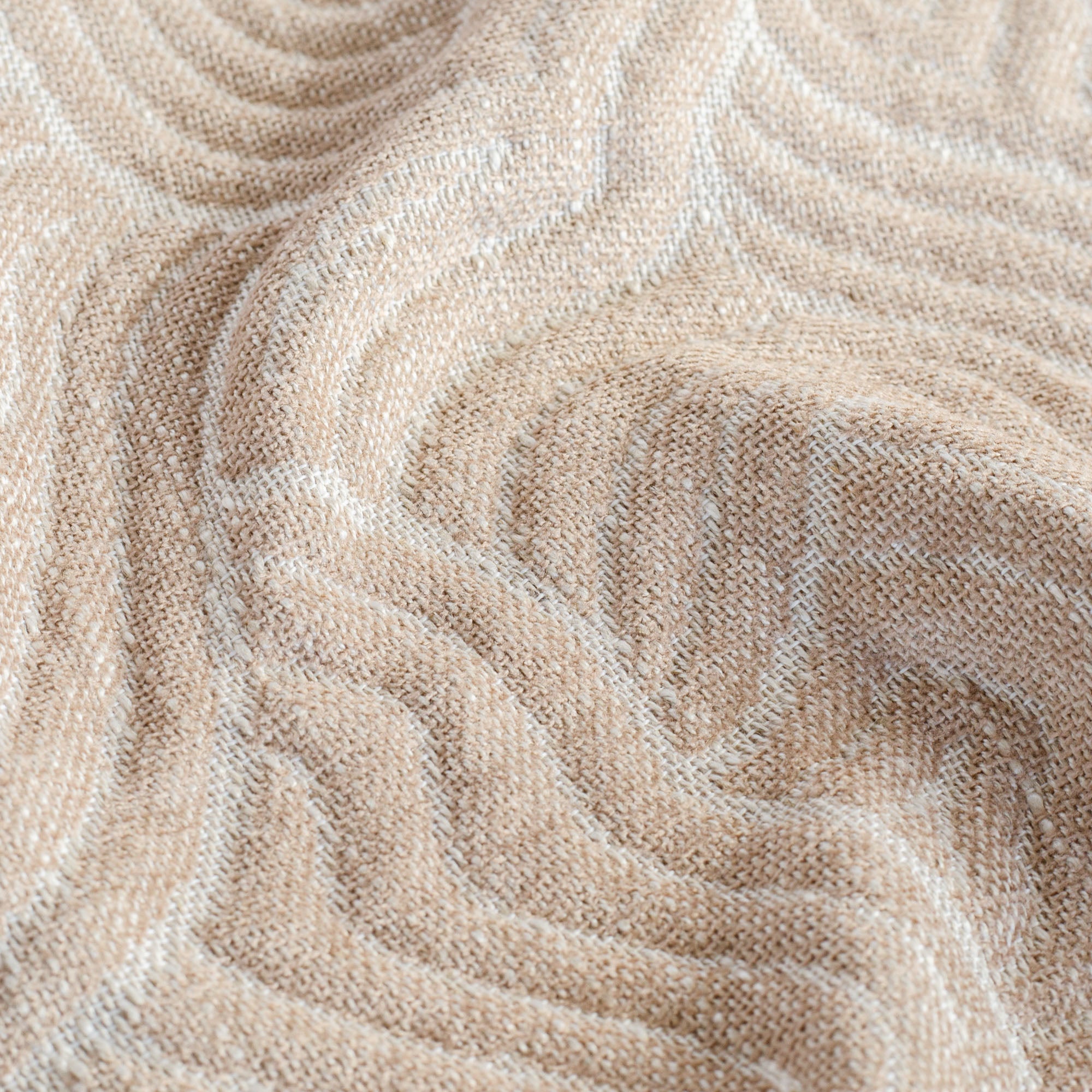 a light pink abstract quilted patterned home decor fabric : close up view