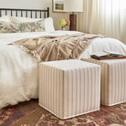 Rexton Stripe Merlot cube ottomans styled in bedroom, beige and burgundy striped fabric by Tonic Living.