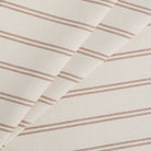 Tonic Living Rexton Stripe Merlot high-performance upholstery fabric in burgundy red and beige ticking stripes, durable home decor textile.