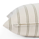 Zipper detail of Tonic Living Rexton Stripe Moss 20x20 sofa pillow in olive green and beige stripe fabric.