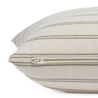 Zipper detail of Tonic Living Rexton Stripe Moss 24x24 sofa pillow in olive green and beige stripe design.
