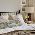 Rexton Moss Stripe 24x24 cushions styled on bed with Manor Tapestry sage green bed bolster pillow