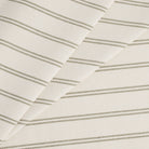 Tonic Living Rexton Stripe Moss high-performance upholstery fabric in olive green and beige horizontal ticking stripes, durable home decor textile.