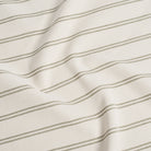 Durable Tonic Living Rexton Stripe Moss upholstery fabric featuring classic stripes in moss green and beige, timeless home decor fabric.