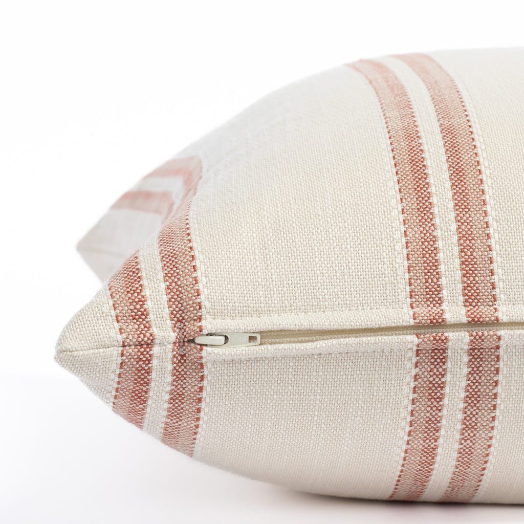 a venetian red and sandy taupe striped outdoor throw pillow : close up zipper view