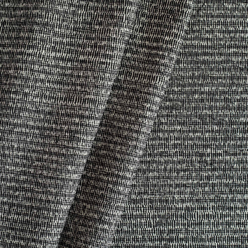 Roman Onyx, a black and off-white textured multipurpose fabric from Tonic Living