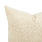 Close up of Tonic Living Rupert Parchment pillow showing its creamy off-white bouclé texture and dimensional weave.
