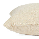 Side zipper detail of Tonic Living Rupert 22x22 toss cushion in creamy off-white bouclé.