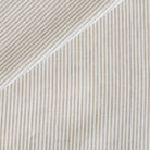 Tonic Living Siena Stripe linen fabric in Buff featuring a neutral ivory and beige vertical stripe.