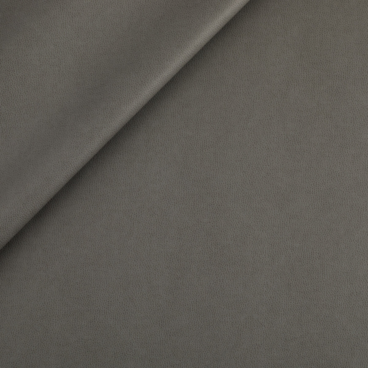 Tonic Living Smythe Faux Leather Fabric in Charcoal, a deep charcoal high-performance upholstery fabric with a natural leather look.