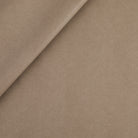 Tonic Living Smythe Faux Leather Fabric in Portobello, a taupe brown high-performance upholstery fabric with a natural leather look.