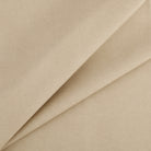 Tonic Living Smythe Sandstone high-performance faux leather fabric featuring a warm neutral beige colour and natural-looking grain.