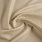 Tonic Living Smythe Faux Leather Fabric in Sandstone, a beige performance upholstery fabric with the rich character of genuine leather