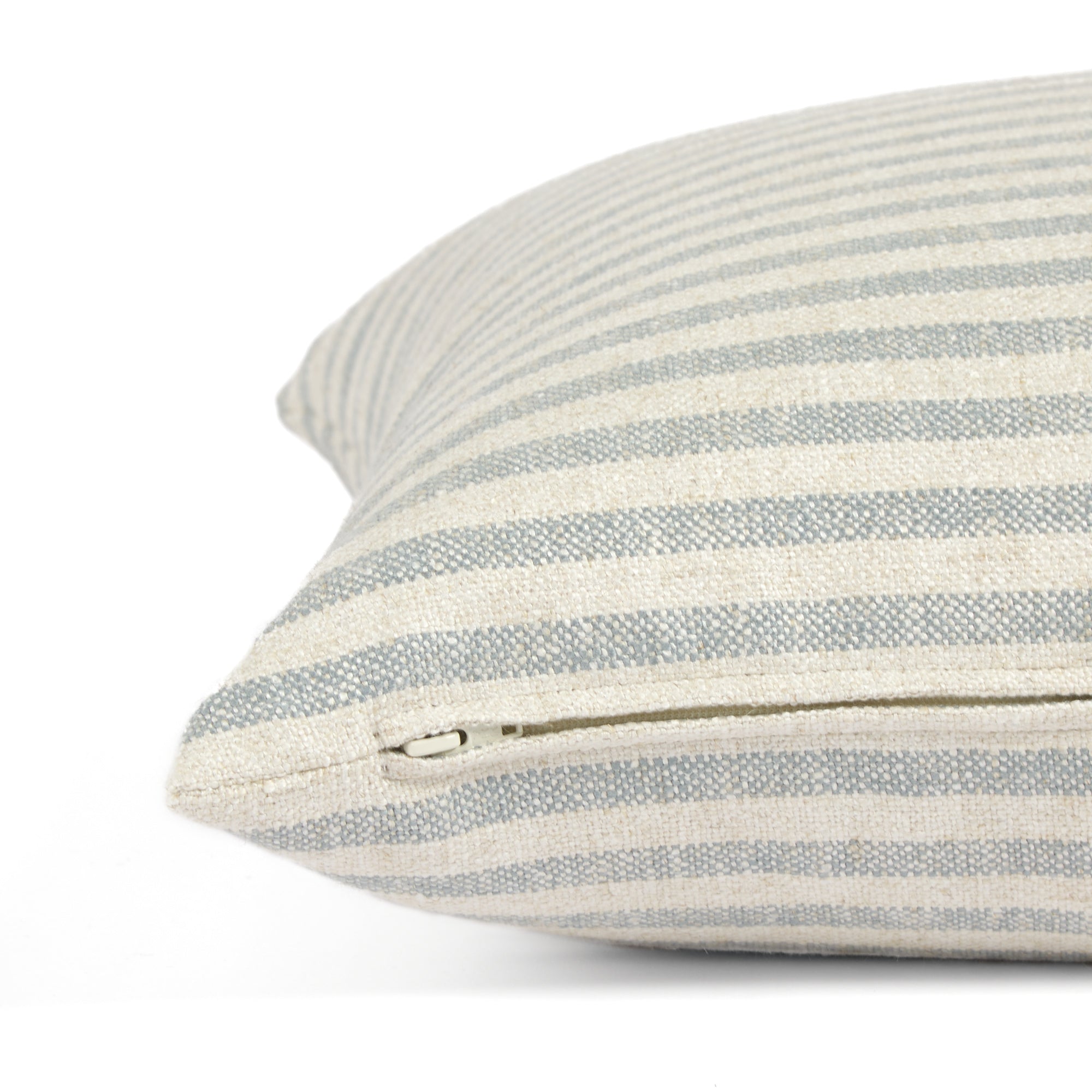 Side zipper detail of Tonic Living Somerset Stripe 20x20 throw pillow in light blue and beige stripe.